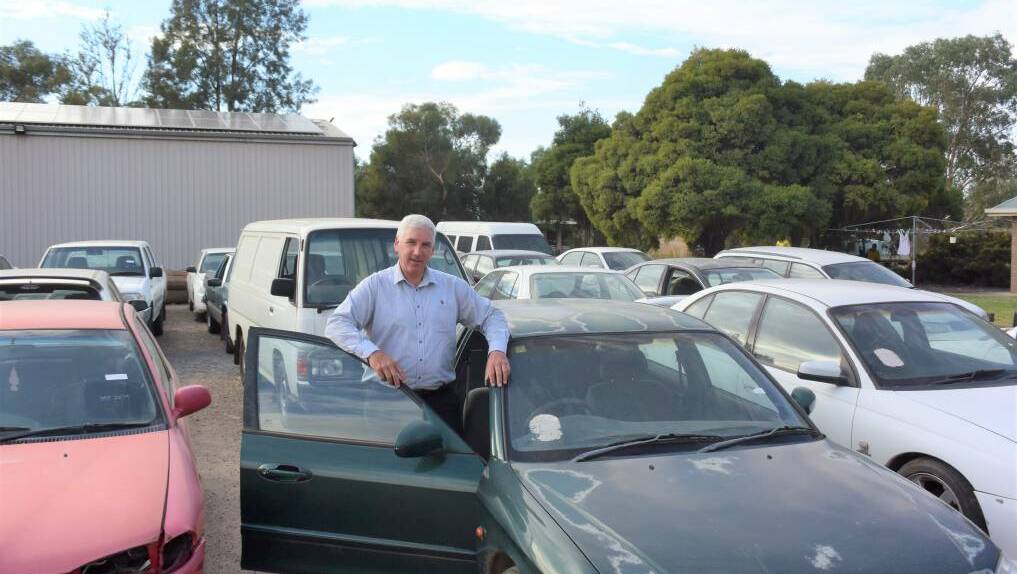 FOR SALE: Wagga City Council's environment and city compliance manager Mark Gardiner photographed in April last year at a car yard sale. Picture: Daina Oliver