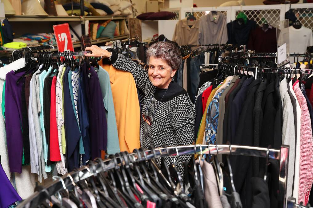 DONATIONS: Wagga Base Hospital Auxiliary Op Shop volunteer Elizabeth Parsons is hanging up the pieces of clothing that was brought into the store for the charity to sell. Picture: Emma Hillier 