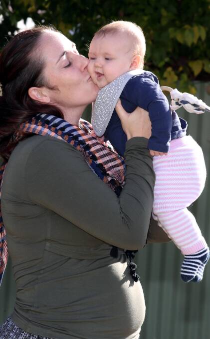 KISSES FOR BUB: Shelley and with her daughter Morgan Wylie at their Turvey Park home. Picture: Les Smith