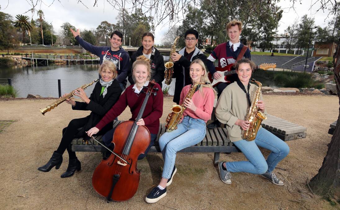 STARS ON THE RISE: Wagga mayoress Jenny Conkey with seven students who are performing at this year's Mayoress Charity Concert. Picture: Les Smith 