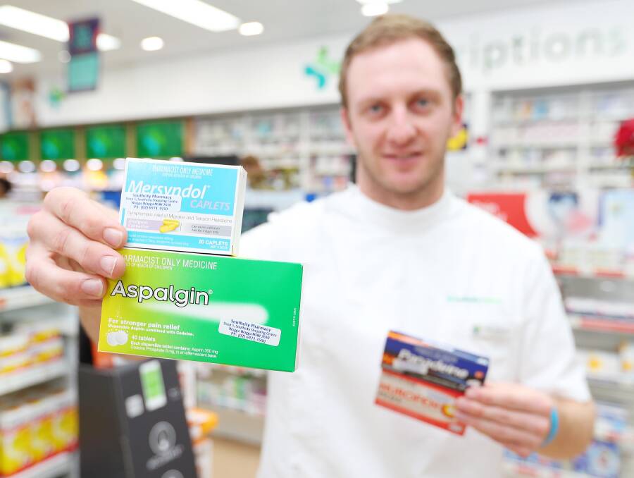 ONE YEAR ON: Pharmacist Tom Adamson from South City Pharmacy with a range of codeine-based pain relief products that are no longer available over-the-counter following a nation-wide codeine ban last year.