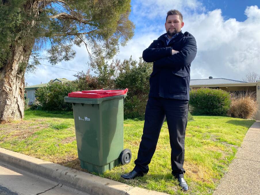 NOT WORKING: Lake Albert resident Kyle Breust wants the return of a weekly collection of the red-lidded waste bins instead of the fortnightly rotation that has been in place for two years. Picture: Daina Oliver 