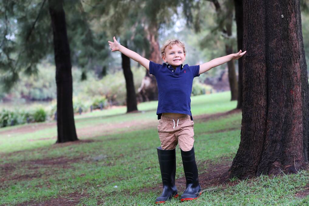 READY FOR RAIN: Brodie Harling of Wagga has his gumboots on and excited for more wet weather to come. Picture: Emma Hillier