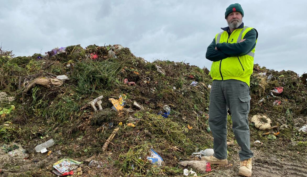 NOT ORGANIC: Gregadoo Waste Management Facility manager Geoff Pym stands near the latest contaminated pile of FOGO. Picture: Daina Oliver