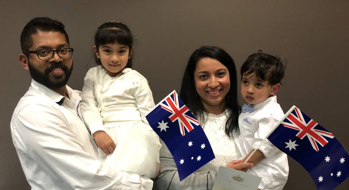 FAMILY CELEBRATION: Nidhish Francis and Ansin Antony celebrate becoming Australian citizens with their children Auniel and Anshel Nidhish on Friday afternoon. Picture: Daina Oliver