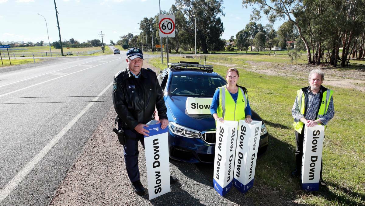 SLOW DOWN: Sergeant Steve Bloomfield and Wagga council's Emma Reynolds and Peter Ross asks drivers to slow down as part of a new campaign. Picture: Les Smith