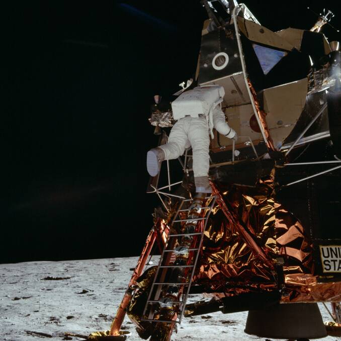 Astronaut Edwin E. Aldrin Jr., lunar module pilot, egresses the Lunar Module (LM) "Eagle" and begins to descend the steps of the LM ladder as he prepares to walk on the moon.