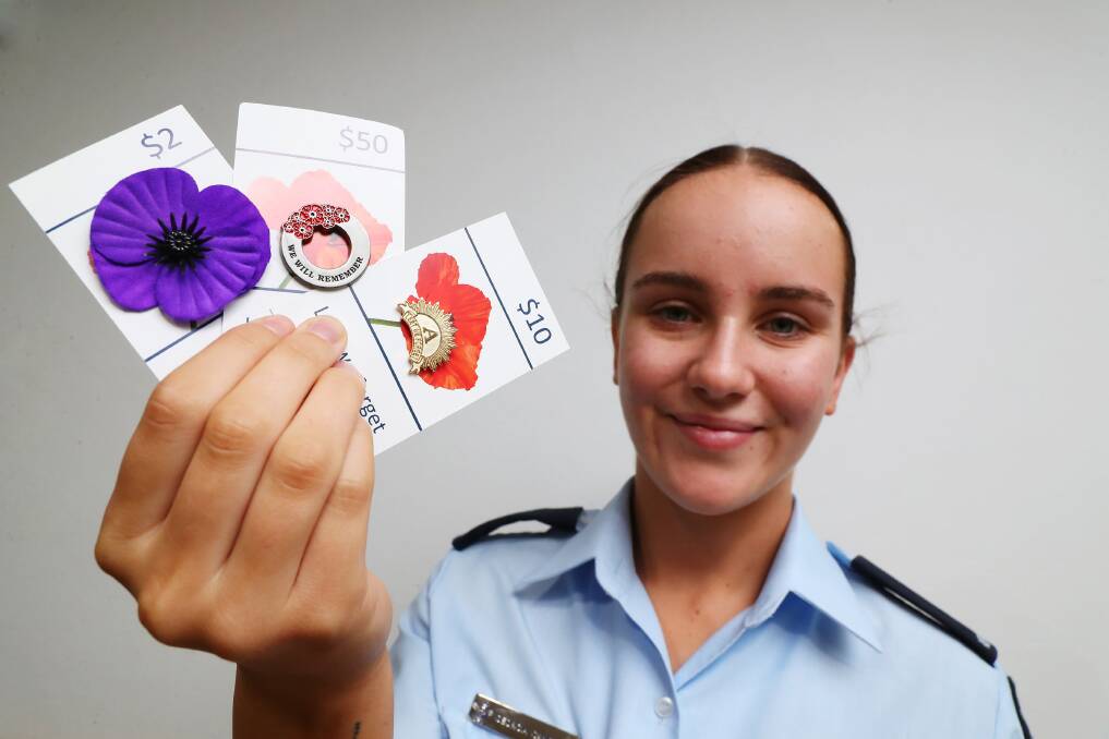 LEST WE FORGET: Aircraft Woman Georgia Campbell selling badges for the Wagga RSL Sub-Branch in the lead up to Anzac Day next week. Picture: Emma Hillier