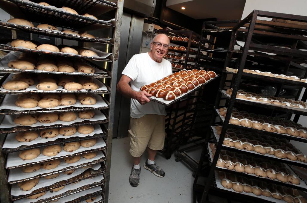 EAT THEM BY THE TON: Peter O'Brien of O'Brien's Hot Bake Bakery prepares hot cross buns ahead of Easter. Picture: Les Smith 