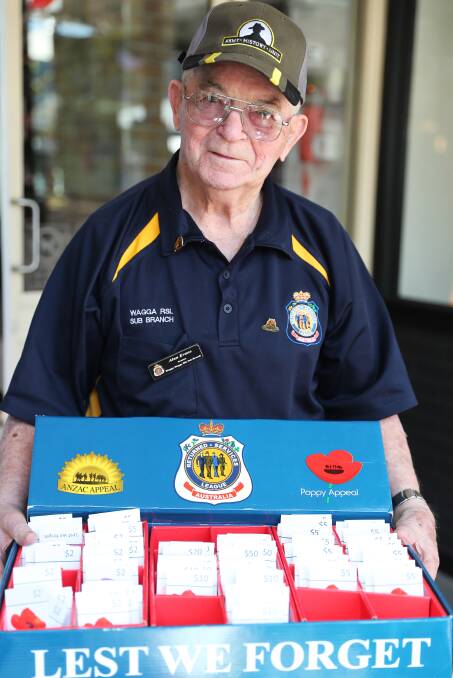 WE WILL REMEMBER: Wagga RSL Sub Branch member Alan Evans selling badges at the Wagga Marketplace in the led up to Anzac Day next week. Picture: Emma Hillier