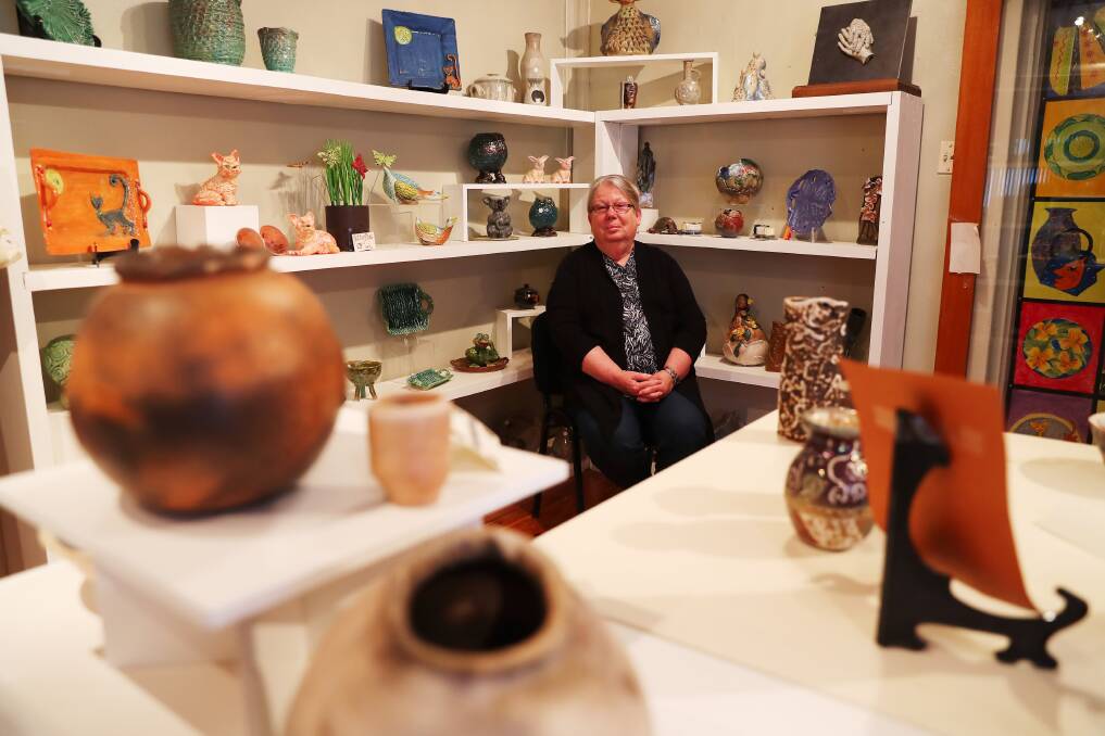 FIVE DECADES: Wagga Potters Club president Di Mahony curated a pottery exhibition celebrating the group's 50 years of craft. Picture: Emma Hillier 