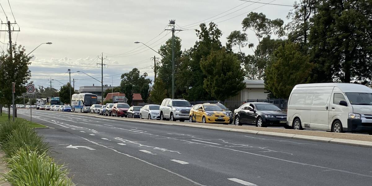 Traffic banked up on the Sturt Highway at the Tarcutta, Edward Street traffic lights. Picture: Daina Oliver