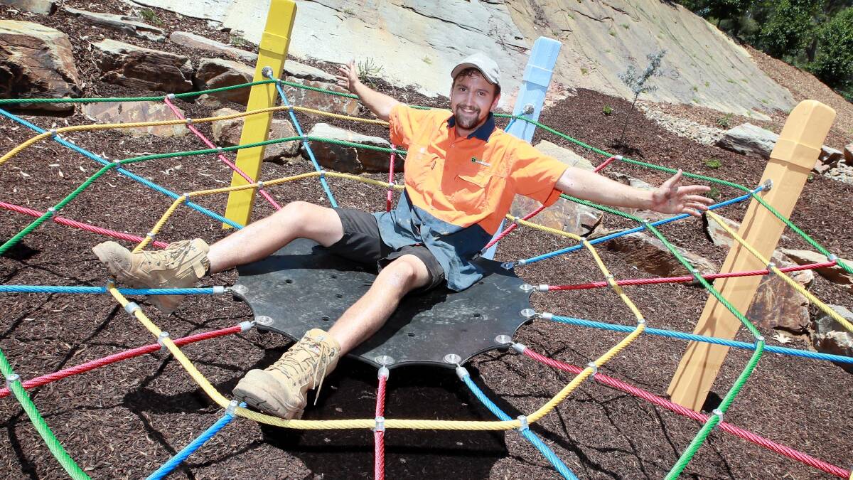 INNER CHILD: Jamie Hill from Creative Outdoors and More testing out his handiwork at the new native playground. Picture: Les Smith