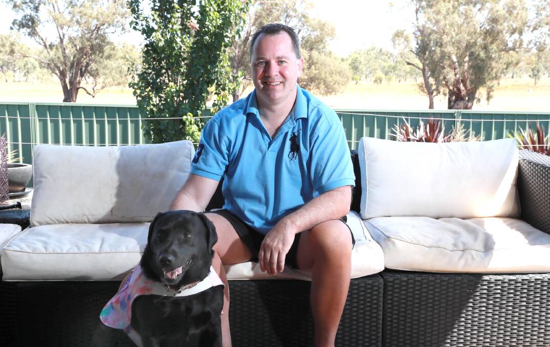 MORE THAN ONE SOLUTION: Veteran Nathan Dean with his service dog Bailey. He supports a royal commission, but it does not end there. Picture: Les Smith 