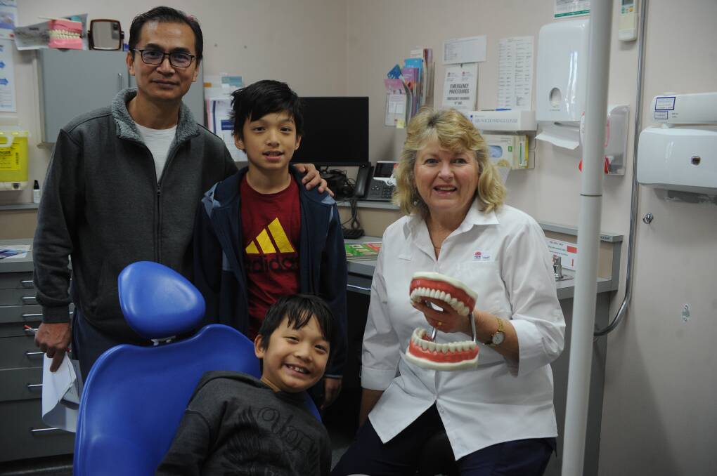 CHECK-UP: Hpi, Wanghum and Wangram Redamwang with Oral Health Promotions Officer Jennifer Lang during their visit to the dentist. Picture: Daina Oliver
