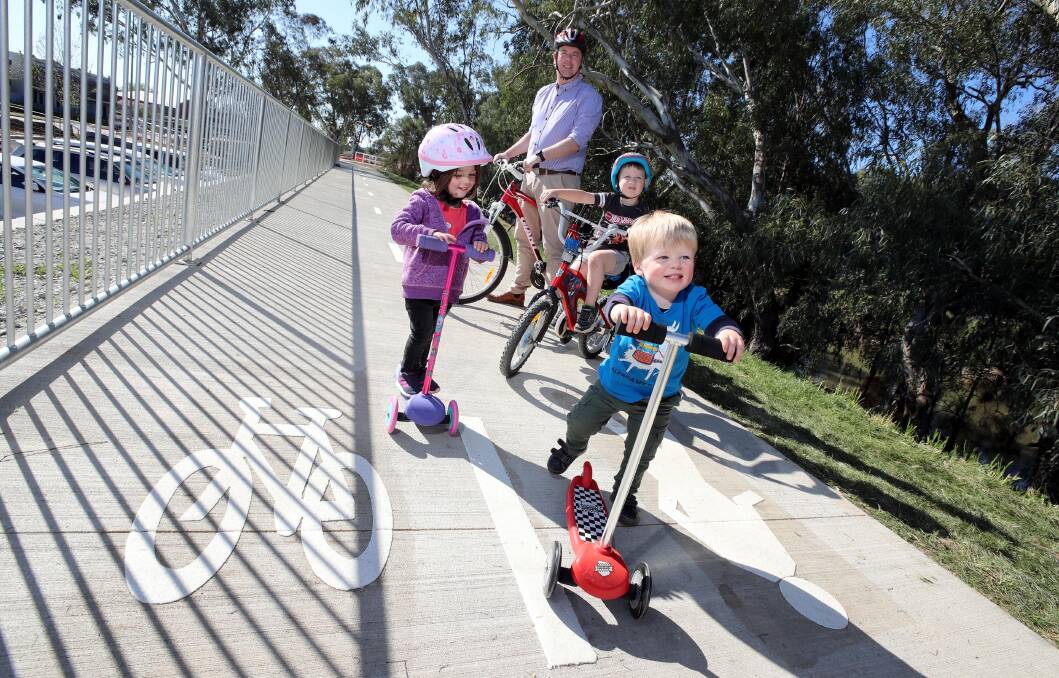 SMOOTH RIDE: Jonah Keyes tests the first cycling link at the main levee in the CBD. Picture: Les Smith