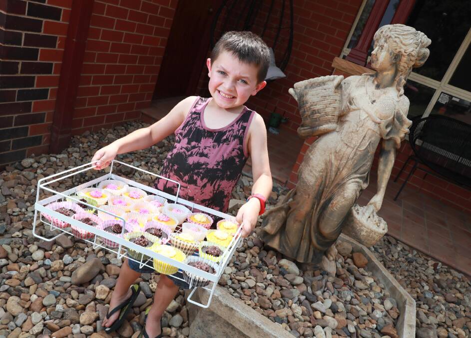 Wagga's Jeremiah Poulos with the cupcakes he was selling to raising money for the Wagga Fire Station. Picture: Les Smith 