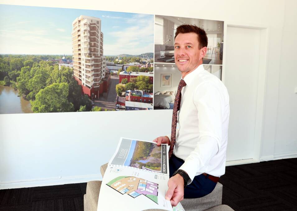 DECISION PENDING: Fitzpatricks Real Estate director Shaun Lowry in the Riverside Apartments display office showing the designs of the Sturt Street development. Picture: Les Smith 