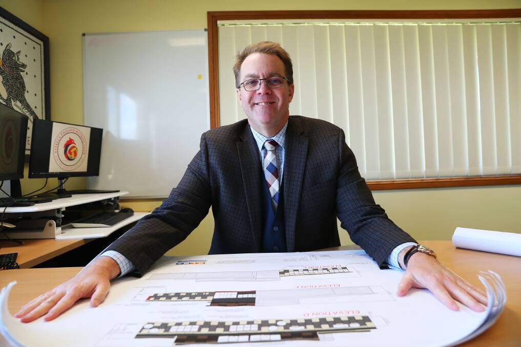 The Riverina Anglican College principal Paul Humble showing plans for the new primary school. Picture: Emma Hillier 