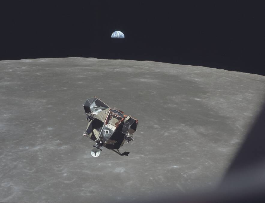 Lunar Module ascent stage, carrying astronauts Neil Armstrong and Buzz Aldrin, approaches the Command and Service Modules for docking in lunar orbit.