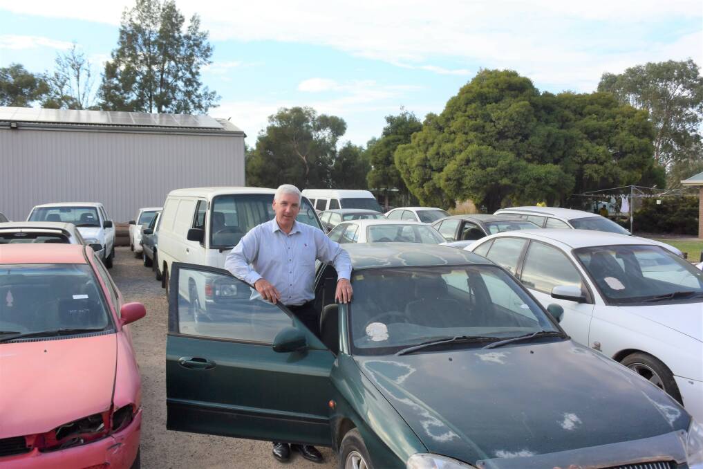 UP FOR SALE: Wagga City Council's environment and city compliance manager Mark Gardiner with the second-hand cars. Picture: Daina Oliver