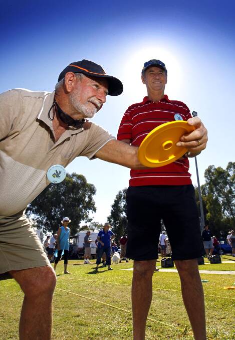 HEAD-TO-HEAD: Jim Fenton of Sydney and John Greenaway of Shoalhaven goes head-to-head in the disc bowls game at Stone the Crows 2017. Picture: Les Smith