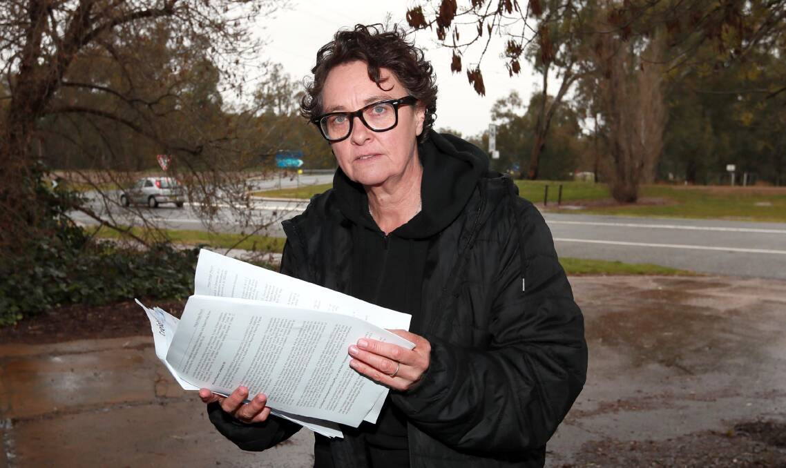 DISGRUNTLED: North Wagga Residents' Association treasurer Fiona Ziff reads through the report produced from a months-long investigation. Picture: Les Smith