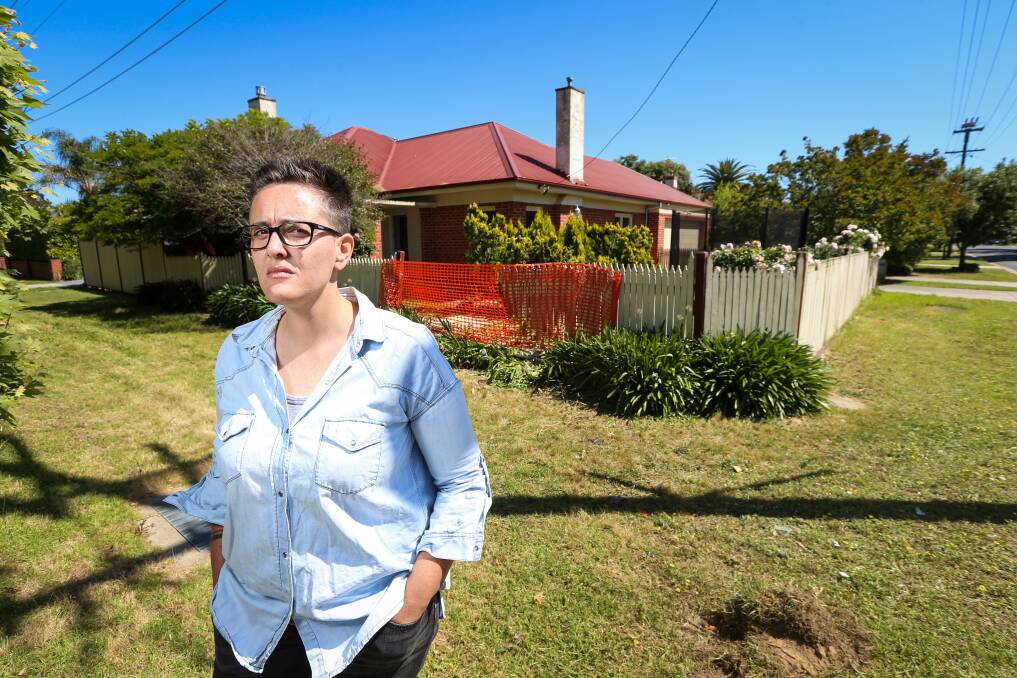 THANKFUL: North Albury resident Amy Coopes is cleaning up the damage to her home after a car was forced into her fence from the impact of a Toyota involved in a police pursuit. Picture: JAMES WILTSHIRE