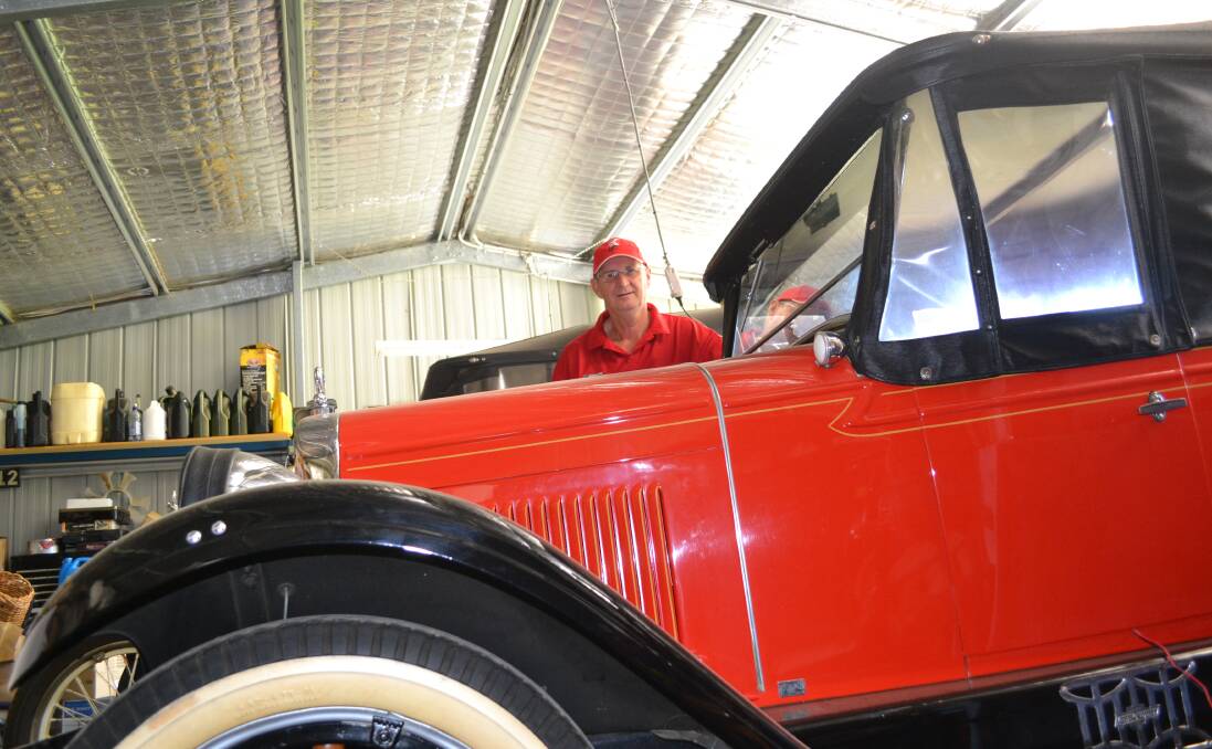 Phil Hoey with one of his vintage cars - a 1927 Chevy.