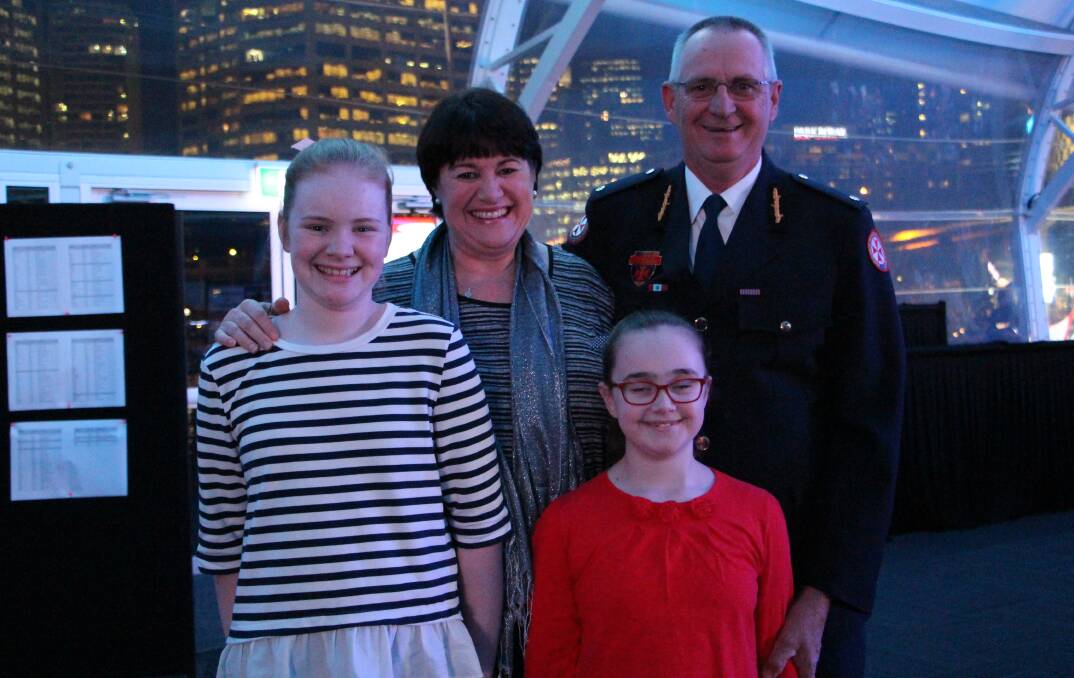 Phil Hoey (right) with his family - Eleanor, 12, Kim, and Katherine, 9 - at the NSW Rotary Paramedic of the Year awards, in which he was a finalist.