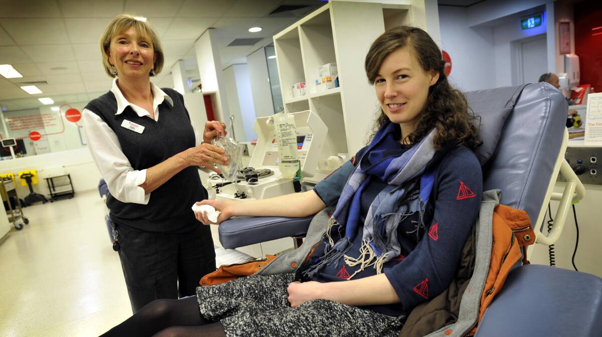 LIFE SAVER: ;University of NSW final year medical student Annaliese Bagust donates blood under the observation of Wagga Blood Bank session leader Angie Gerlach. Picture: Les Smith