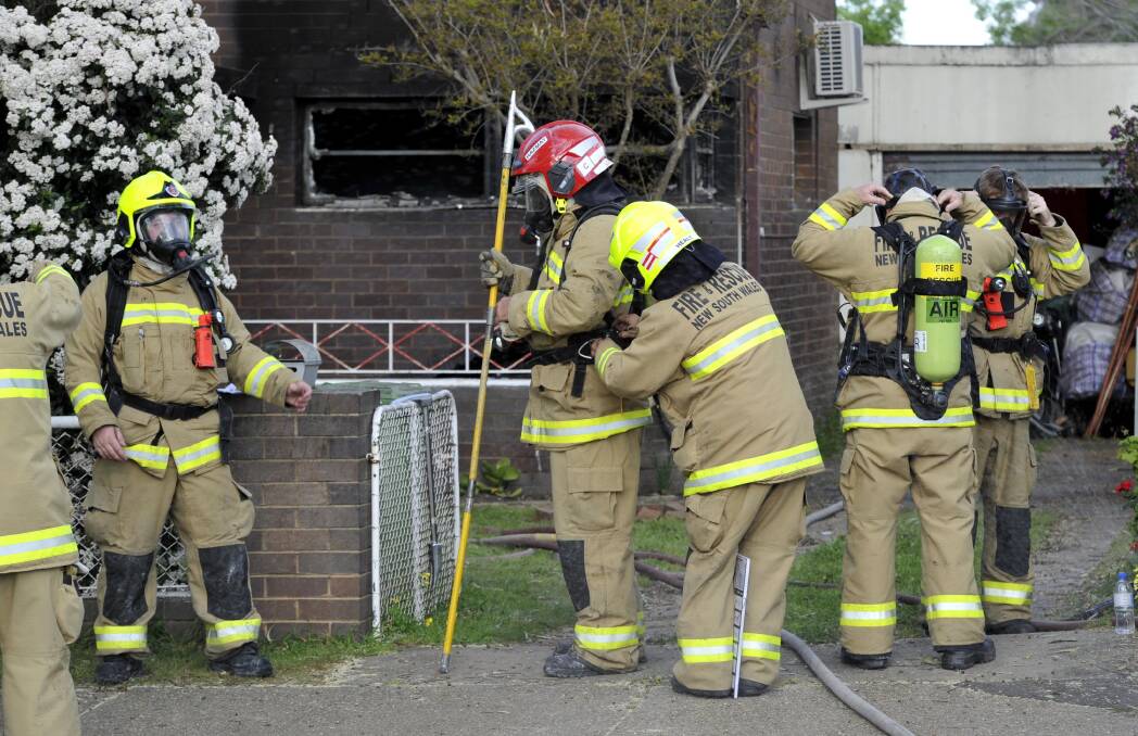 ACTION: Firefighters attend a house fire in Wagga last year. Station commander Chad Kennis is warning residents to be careful over the winter months.