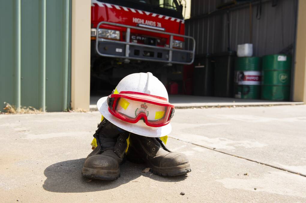 Firefighting gear left outside the Tumut Rural Fire Service shed as a mark of respect for the firefighters who have died in NSW bushfires. Picture: Dion Georgopoulos