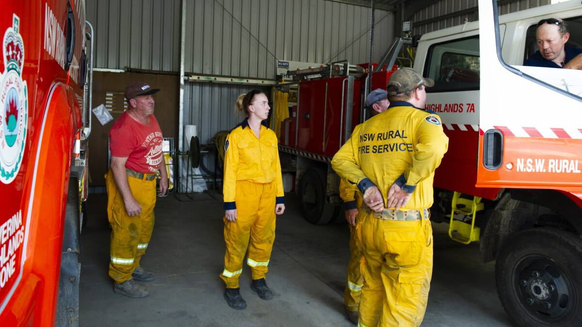 Tumut Rural Fire Brigade volunteers prepare to be deployed to fight a fire threatening Batlow. Picture: Dion Georgopoulos