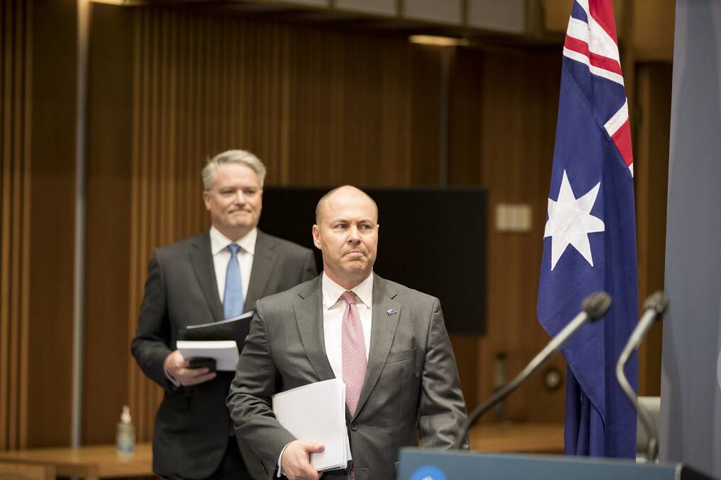 Finance minister Mathias Cormann and Treasurer Josh Frydenberg arrive for a media briefing on the 2020-21 Federal Budget at Parliament House on 6 October, 2020. Picture: Sitthixay Ditthavong