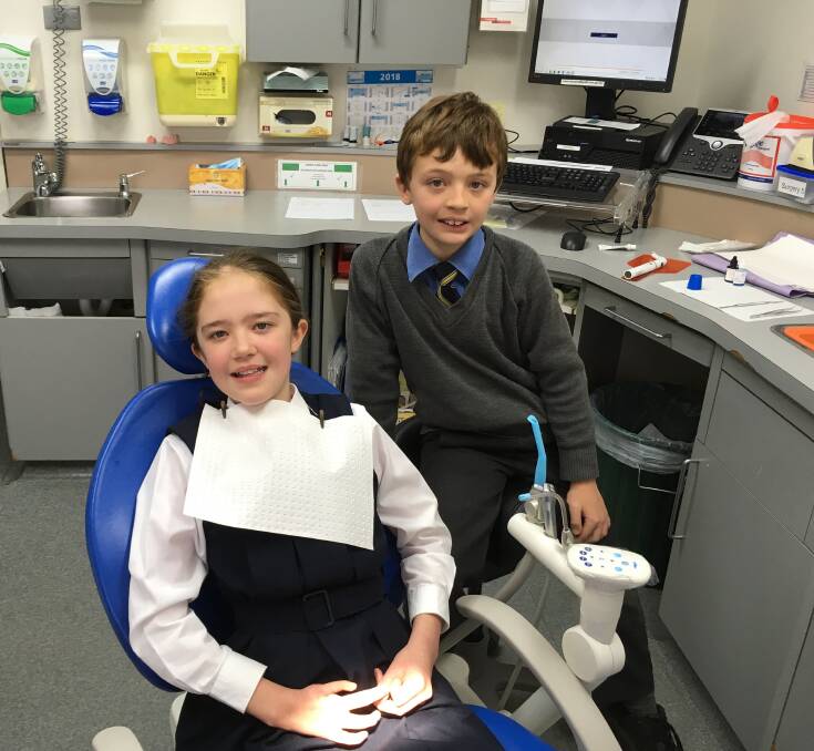Charlotte and Andrew Gibbs on a visit to the MLHD dental clinic in Docker Street for a check-up.