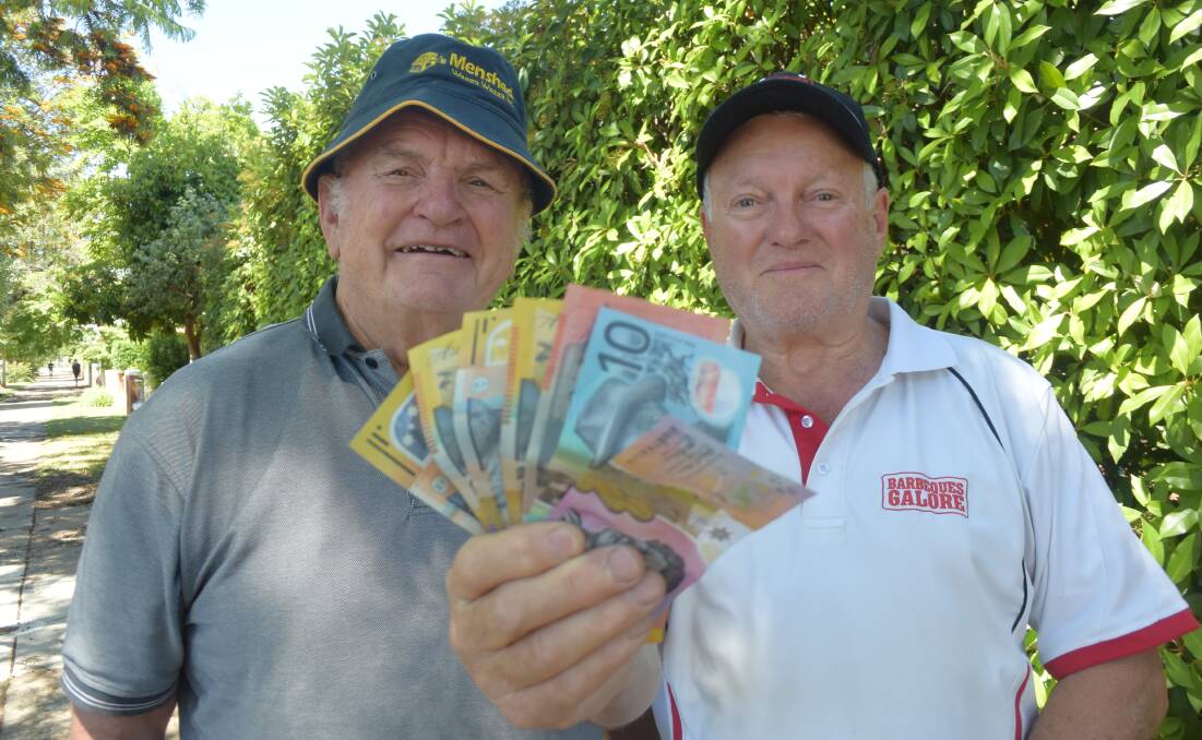 FISTFUL OF DOLLARS: Rick Priest of the Wagga Men's Shed and businessman Gary Gurtner are thrilled with the support they have received. Picture: Jody Lindbeck