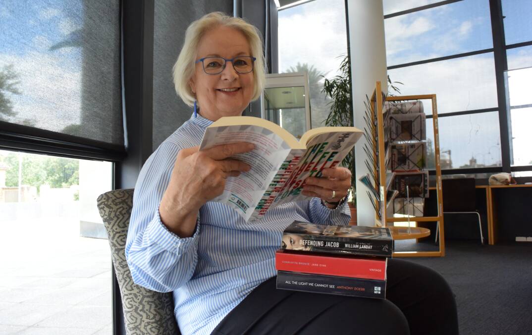 BOOKWORMS UNITE: Claire Campbell, Wagga City Council’s manager of library services, with some of the many options on the book club reading list. Picture: Jody Lindbeck