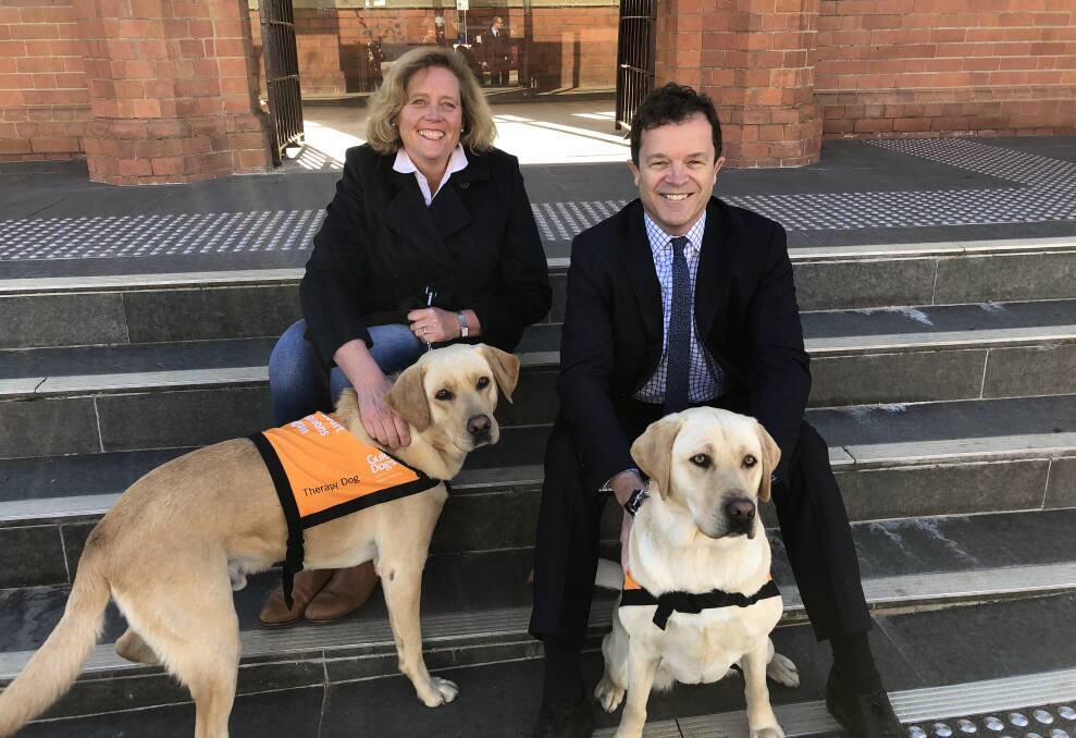 Attorney-General Mark Speakman and Liberal candidate for Wagga Julia Ham with Finn and Nelly, two pets as therapy dogs.