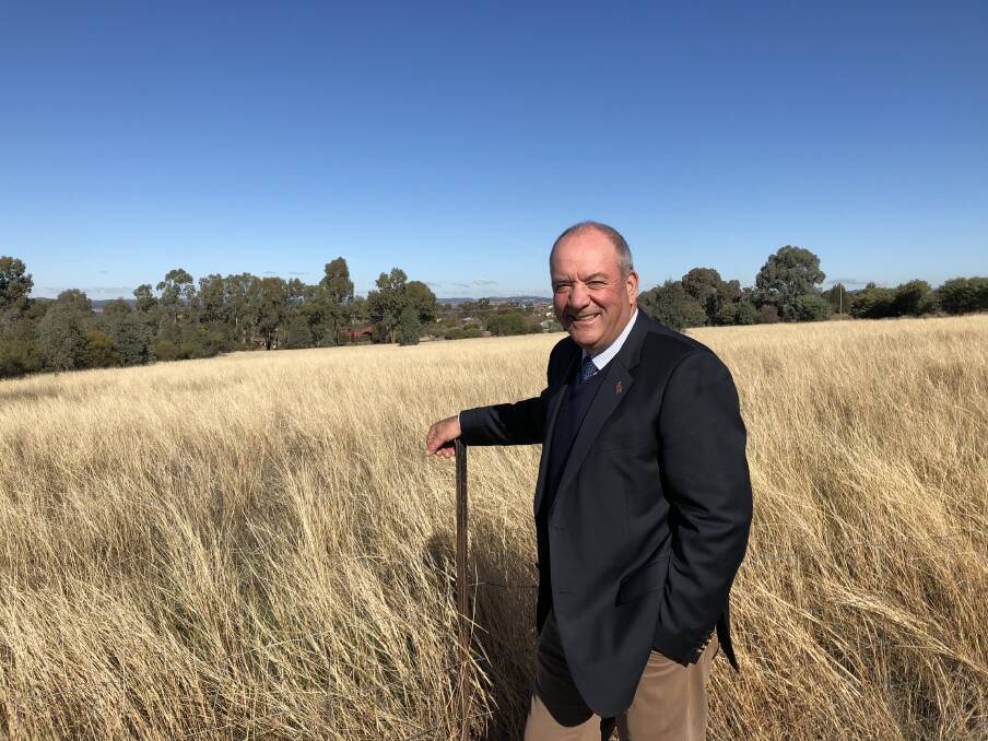This vacant land behind Member for Wagga Daryl Maguire will be transformed into Wagga newest primary school by 2021. Picture: Jody Lindbeck