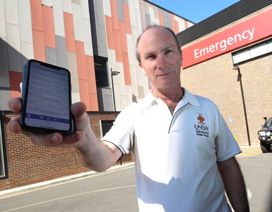 TECH TRIAL: Wagga Base Hospital emergency department director Stephen Wood would prefer a phone over a tablet to receive information about patients' pathology results in upcoming program trial. Picture: Les Smith