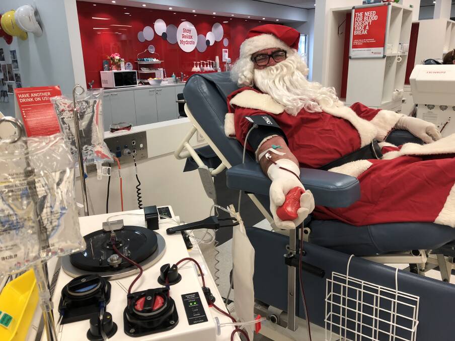 LIFE SAVER: Despite his busy schedule, even Santa Clause found time to give a life-saving gift of blood at the Wagga Donor Centre. 