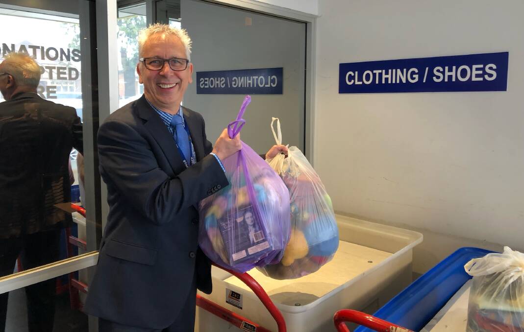 WINTER HELP: Mike Riley from St Vincent de Paul in Wagga with some of the items people have donated to help the charity. Picture: Jody Lindbeck
