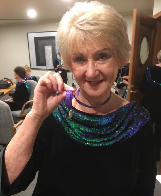 Judy Ferguson with her gold medal.