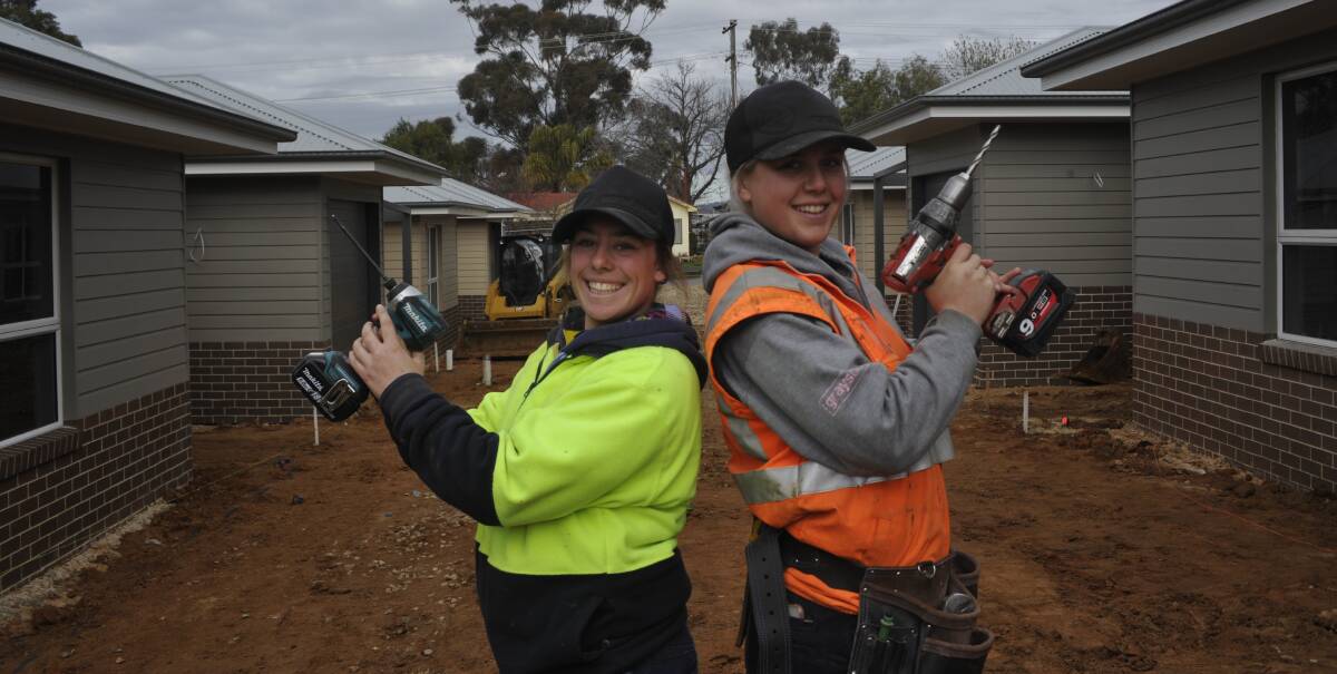 LADY TRADIES: Wagga apprentices Grace Di Trapani (left) and Natalie Creed (right) are two of a growing number of young women taking on jobs in the construction industry. Picture: Jody Lindbeck