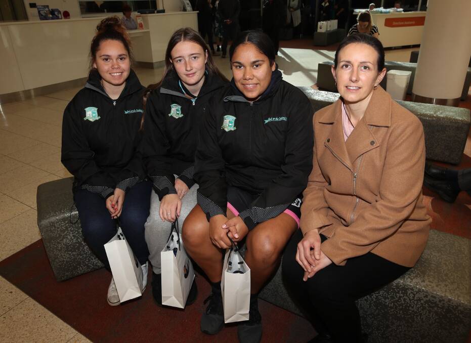 TALKING CAREERS: Charisma Pitts, 17, Charlotte Mitchell, 17, and Vanessa Harris, 16, from Mount Austin High School with Murrumbidgee Local Health District's clinical nurse specialist for Aboriginal leadership and development Angella Damm. Picture: Les Smith