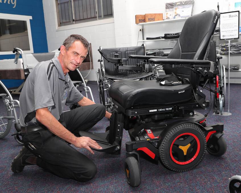 Shane Cattanach of Better Mobility with a powerchair.