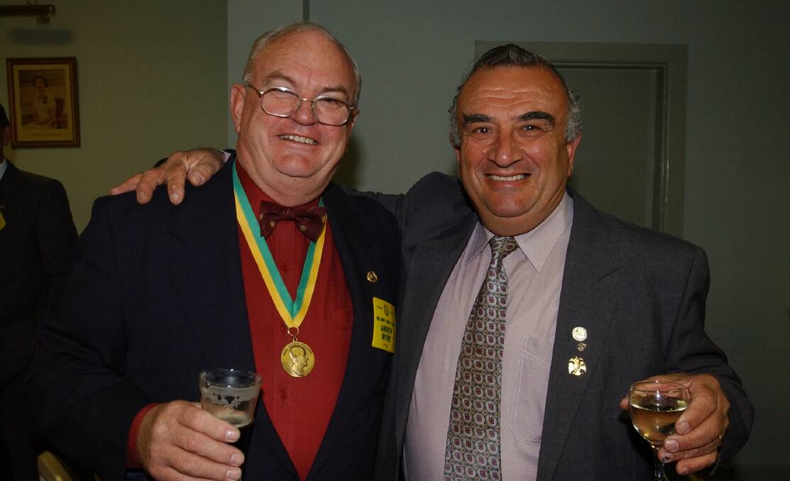  Michael Georgiou, right, with fellow Rotarian Rick Priest in 2002.