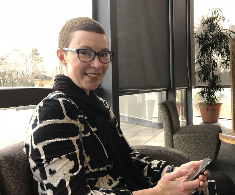 STILL STORIES: Amy Heap, the Riverina Regional Library’s outreach and promotions co-ordinator accesses a streaming service on her phone. Picture: Jody Lindbeck