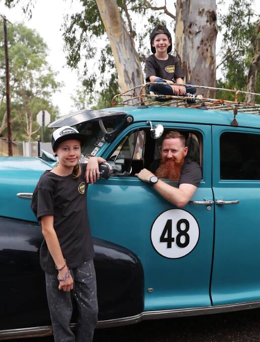 DRIVING IN: Riverina Rumble organiser Howard Brown, with son Spencer, 6, and daughter Felicity, 12, in their 1948 Chevy. Picture: Emma Hillier